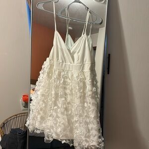 White mini dress with floral 3D detail